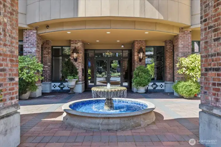 Fountain out front of building.