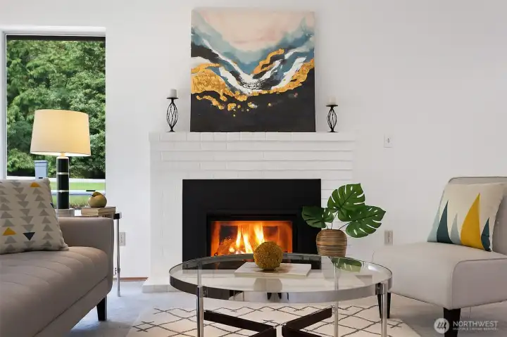 A cozy gas fireplace anchors the living room, casting a warm glow that invites you to slow down, stay in, and savor the comfort of home right where you are.