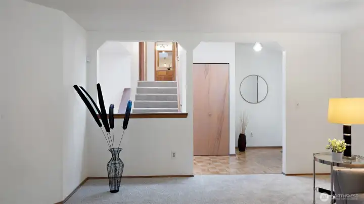 The entry offers a cozy spot for a small table to drop your keys or add a touch of décor, along with a full coat closet to keep things neat and organized. It’s a welcoming and functional first impression.