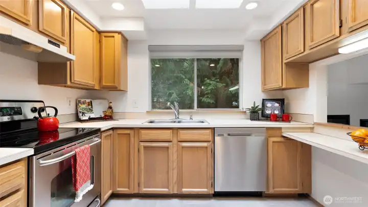 This classic kitchen has such a happy feel, with sunlight pouring in through the huge skylight above. Newer stainless steel appliances keep things fresh and functional, and the bright, cheerful vibe makes it a space you’ll actually love spending time in.