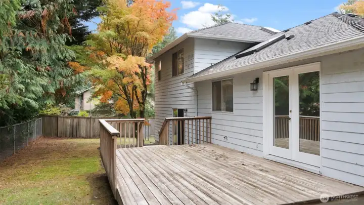 The large back deck connects seamlessly to the dining room through the beautiful French doors. It’s an easy extension of your living space - perfect for outdoor dining or soaking up a little sunshine.