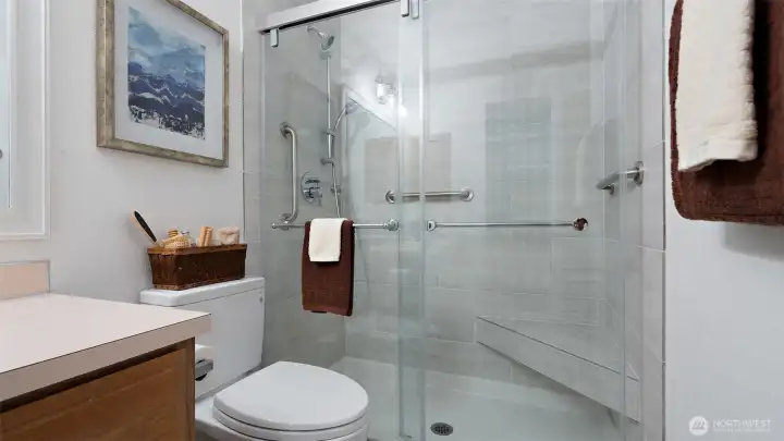 Check out the newly updated walk-in shower off the primary! It's fresh and modern, with a built-in bench that makes it both beautiful and comfortable to use every day.