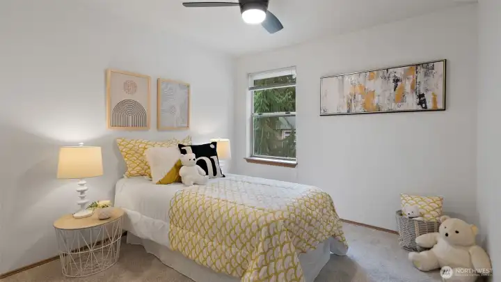 Bedroom two feels light and welcoming, with fresh carpet underfoot and a new ceiling fan overhead. It’s move-in ready and full of natural light -- an easy space to make your own.
