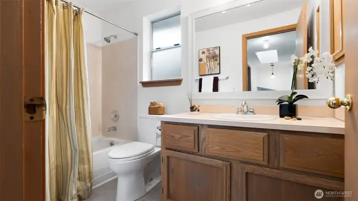 At the end of the hall, the main full bath is bright, clean, and ready to serve the upper bedrooms. It’s well placed and easy to access for everyone upstairs.