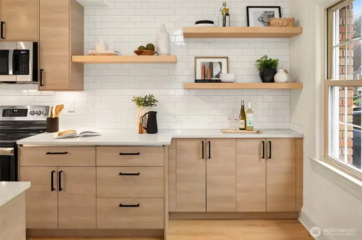 Floating shelves and tons of kitchen storage.