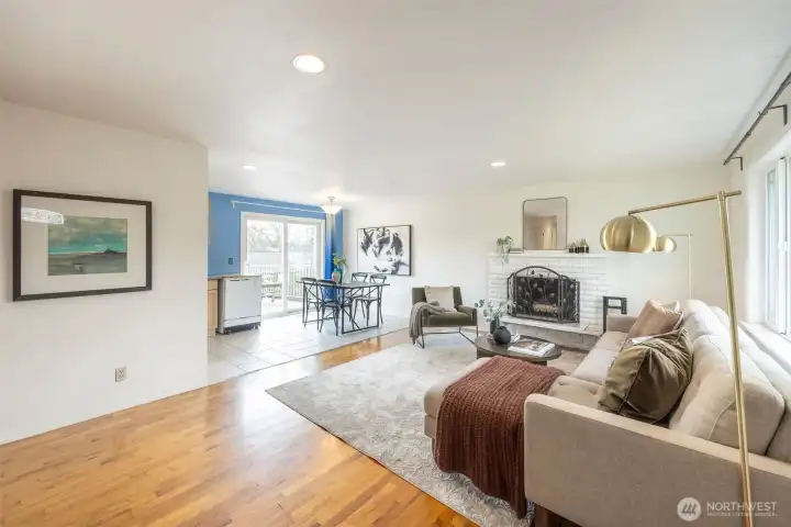 Lovely living room with wood burning fireplace.