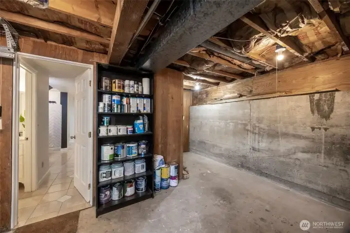 Attached garage, with room for storage or a work bench.