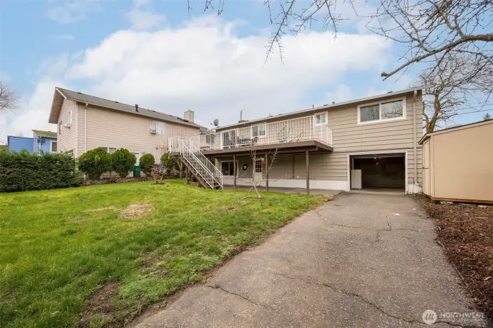Alley access to the backyard driveway and garage. Great storage shed on the right.
