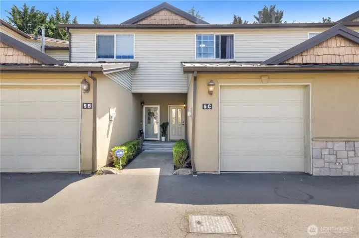 Unit 5C on the right side. The garage leads into  the home from the inside.