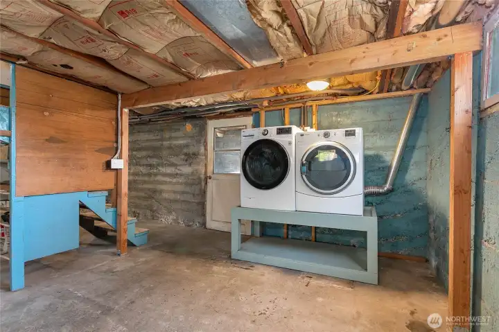 Unfinished basement makes for perfect extra storage space and is also home for the washer and dryer