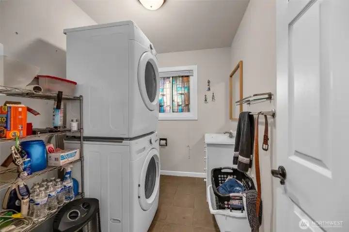 Landry room with 1/2 bath and more storage.