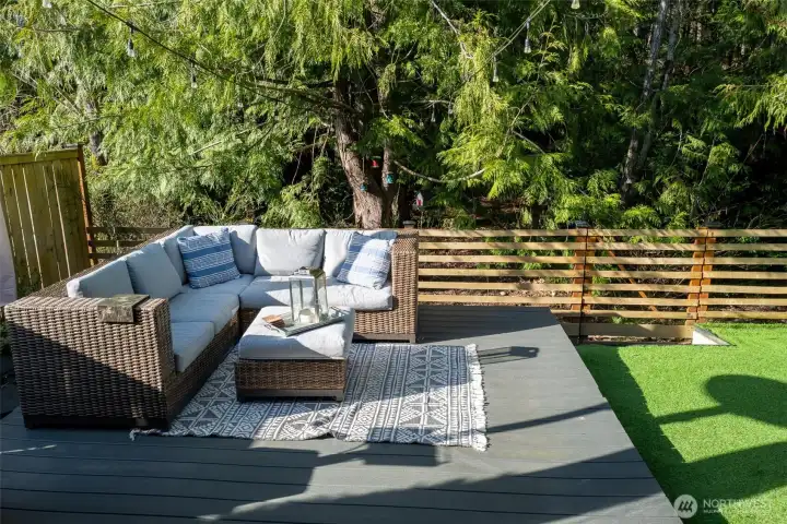 New deck, fresh green turf and a fully-fenced backyard.