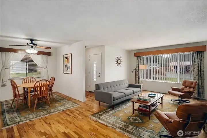 Virtually staged living room and dining area. Virtually staged living room and dining area.