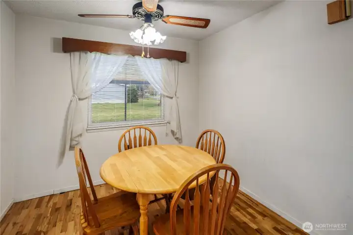Dining area has hardwood flooring, and the kitchen is directly off to the left. Dining area has hardwood flooring, and the kitchen is directly off to the left.