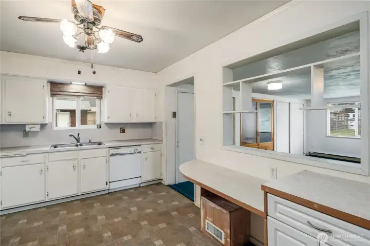 The kitchen has real wood cabinets and eating bar. The kitchen has real wood cabinets and eating bar.