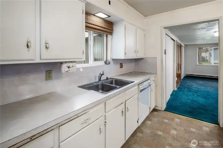 The kitchen has good working room and is open to the family area. The kitchen has good working room and is open to the family area.