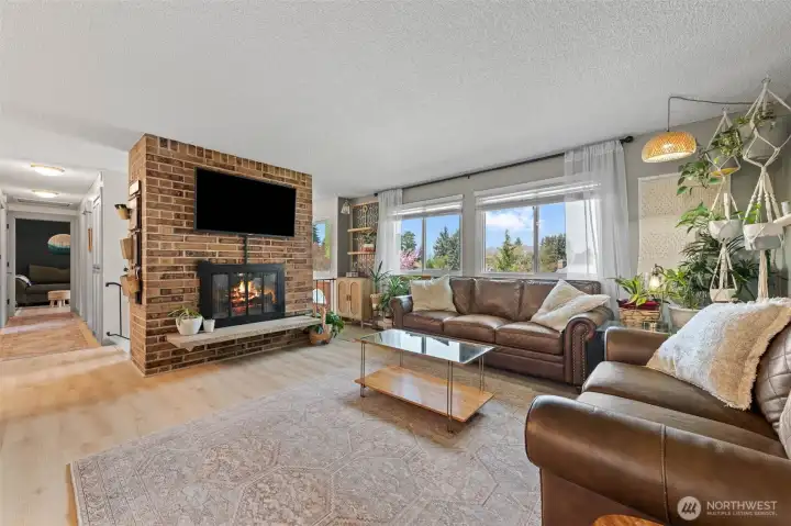 Upstairs has a large living area with big windows