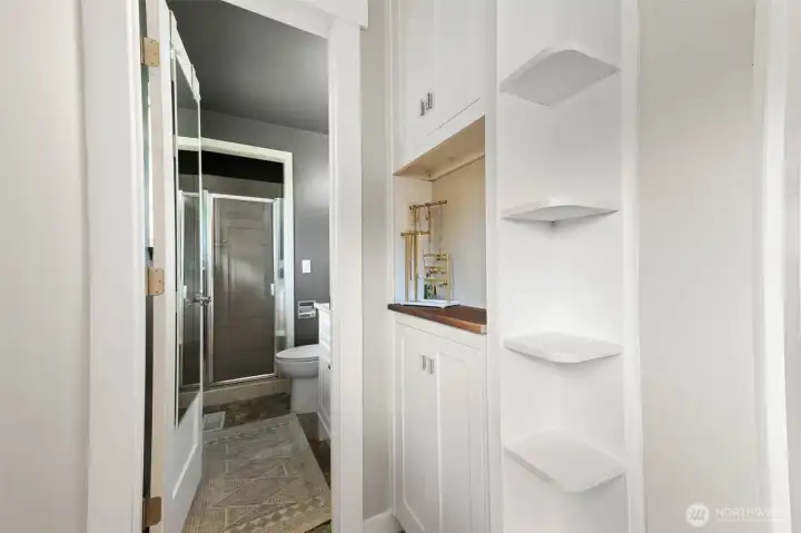 Built in shelving before bathroom