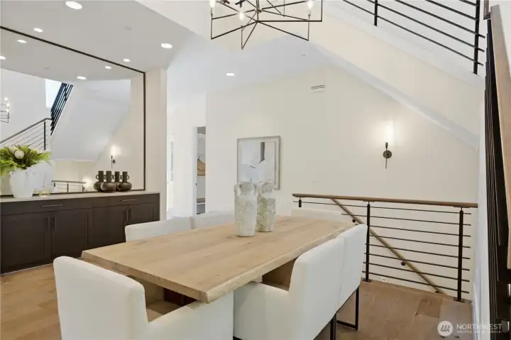 Dramatic two-story dining room creates an immediate sense of scale