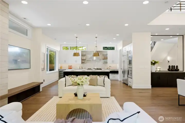 Seamless sightlines from the living room into the kitchen and dining area, enhancing the home’s open-concept flow.