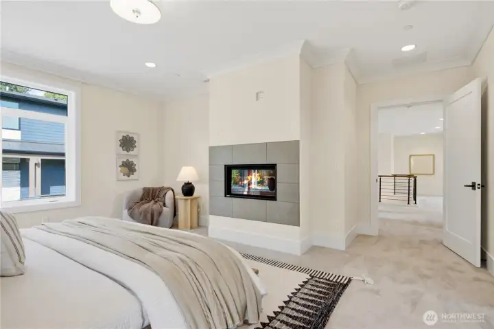Luxurious owner’s retreat with cozy fireplace and peaceful ambiance