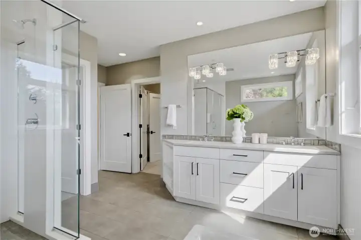 Spa-inspired primary bath featuring heated floors