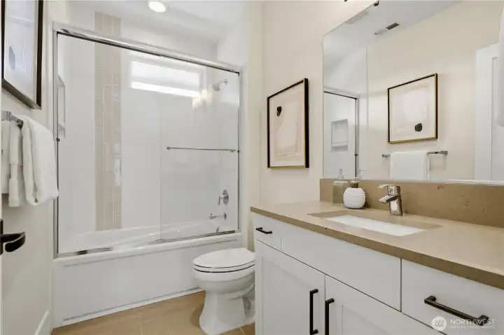 Guest bath located at the top of the stairs! Check out the details in the shower!