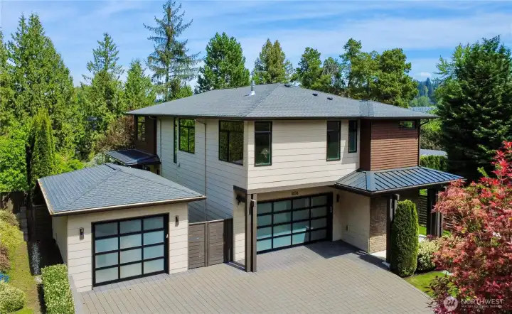 EV charger and rare three-car garage for modern convenience