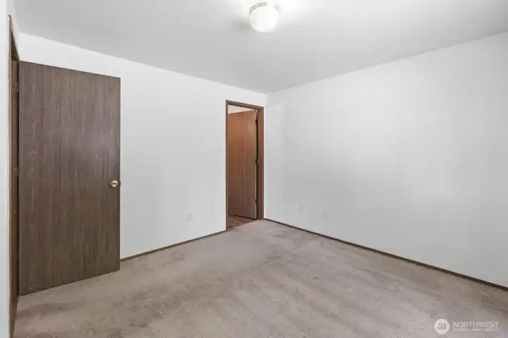 Another view of primary bedroom