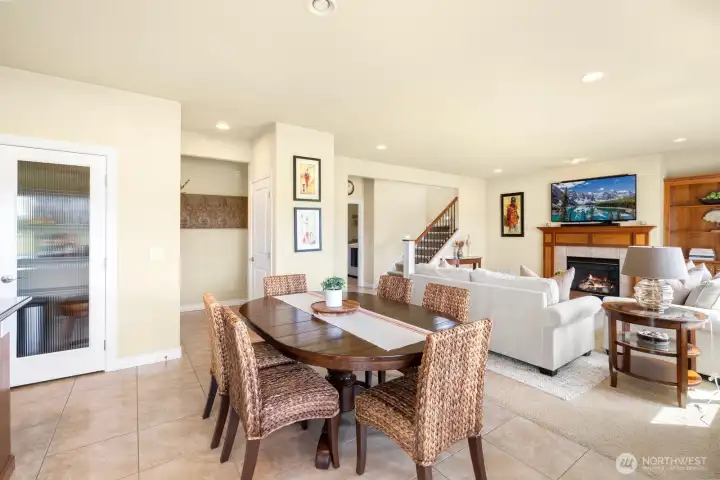 Open floor plan with eating area off kitchen and cozy, spacious family room.