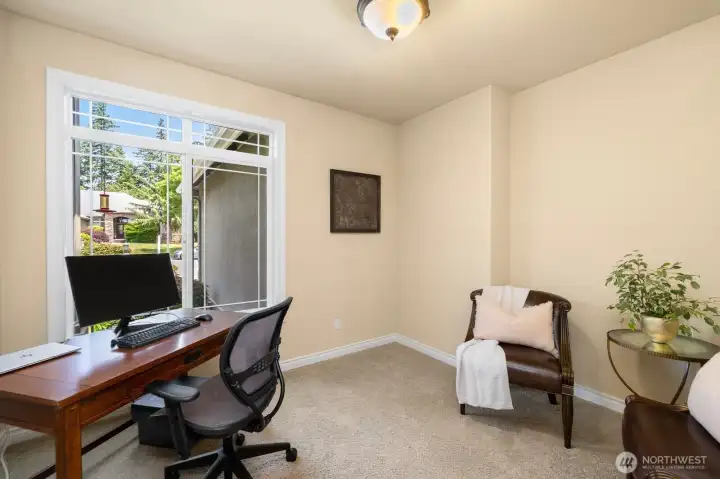 Private office off entry with french doors.