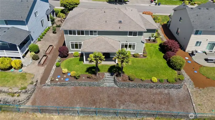 Mature, low maintenance landscape with irrigation is a plus!