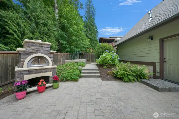 Wood-fired pizza oven is included