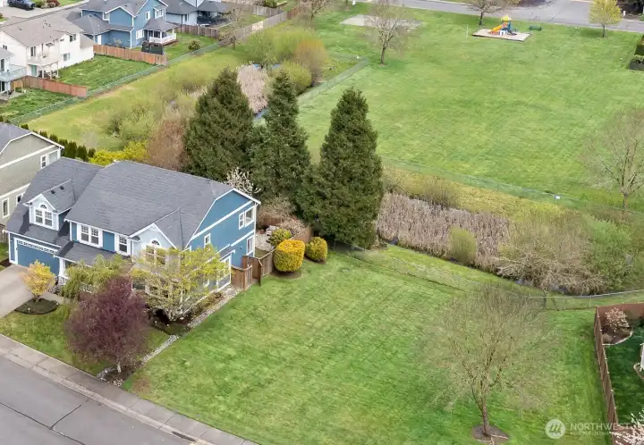 Huge home with the community park wrapping around it.