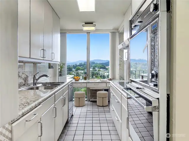 Original galley style kitchen has glorious views and is ready for a makeover!
