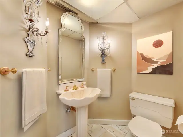 The powder room is in the front hallway.