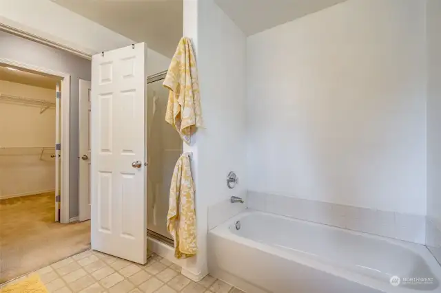 Primary bath with tub and separate shower.