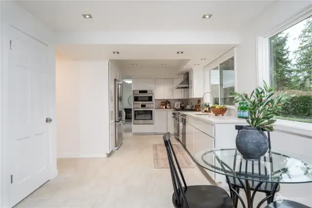 Across from the breakfast nook is the door to the pantry and garage