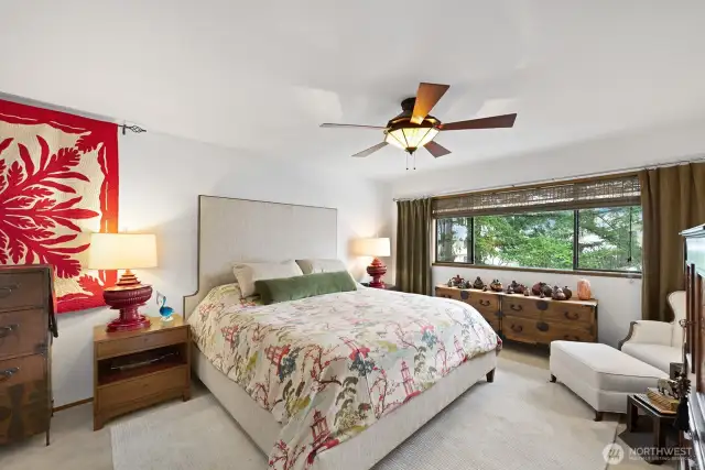 The primary bedroom will accommodate a king bed and two nightstands with room to spare. The window treatments here are woven window blinds with Conrad valances.