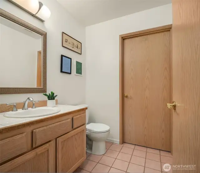 Main Floor Powder Room With Enclosed Laundry Room