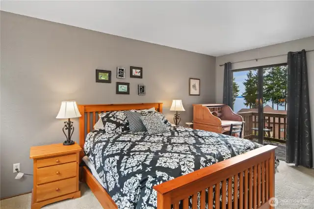 Primary bedroom w/ private deck