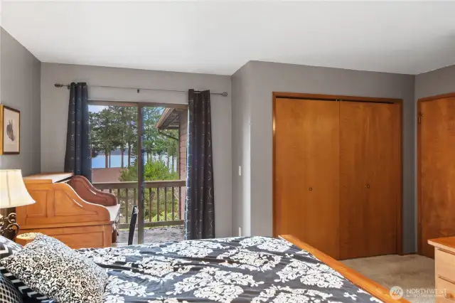 Primary bedroom looking toward deck and closets