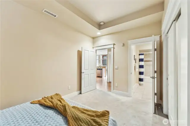 Spacious Primary Bedroom with a wall of closet space on the right.
