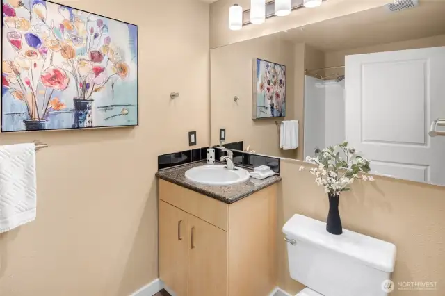 Crisp and clean with sleek accents, the bathroom offers just the right touch of style to start and end your day.