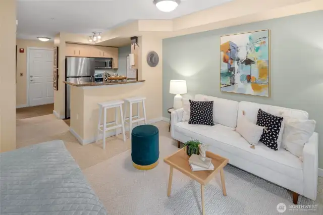 Everything you need is right here: a comfy sitting area, an inviting breakfast bar, and seamless flow from kitchen to couch.