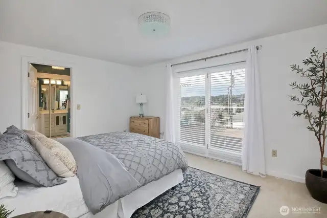 We are back on the main level, right off the hallway from the family room. Glass door opens to the deck, yes you have a view and 3/4 bath is through the open door.