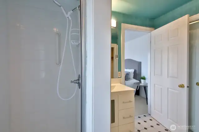 This bathroom has been remodeled with a new shower, vanity and light fixtures. There are two closets in this bathroom!