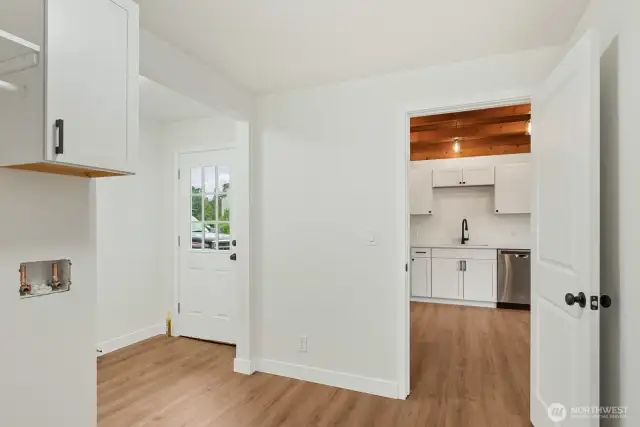 Laundry room looking into mudroom and kitchen