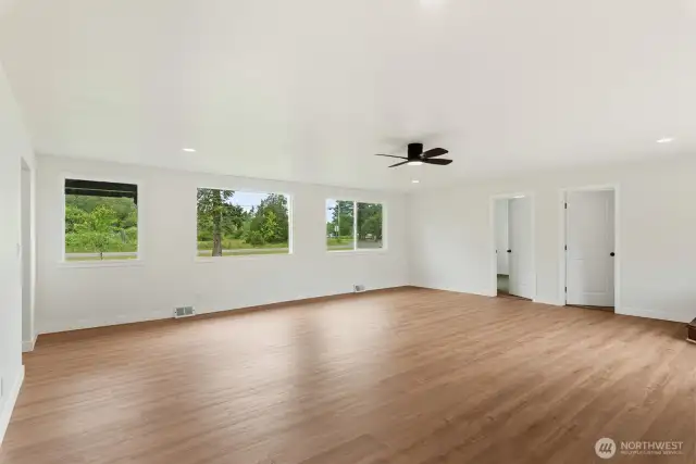 Another view of the living room with an abundance of natural light