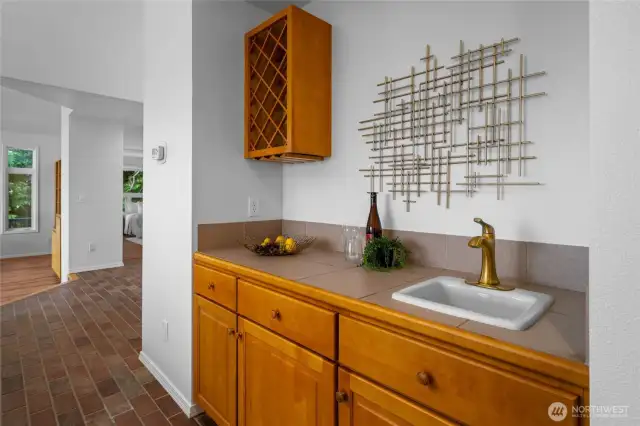 Convenient wet bar with wine storage offers the perfect spot for entertaining or winding down.